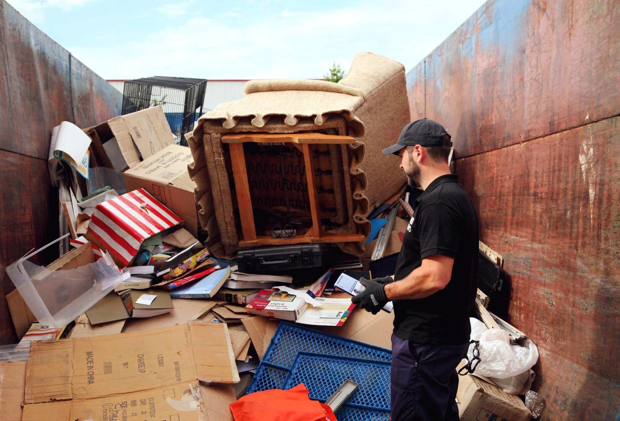 Professional junk removal team loading boxes and furniture into truck for Dump Pro LA service in Los Angeles