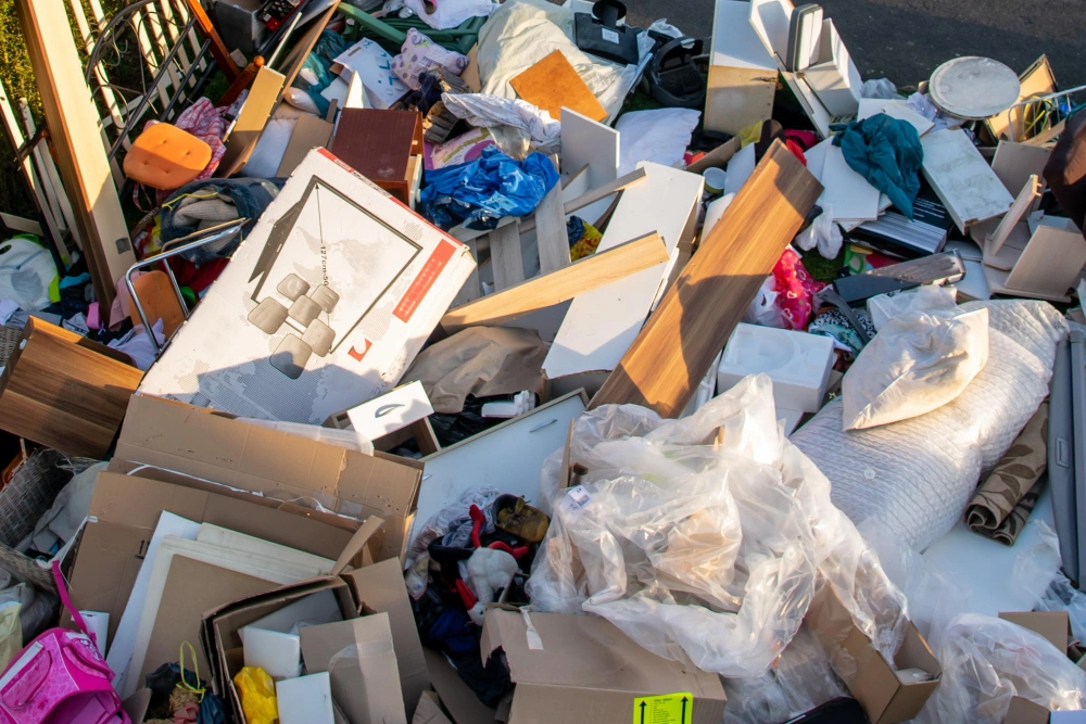 Mixed household junk piled for removal during residential service by Dump Pro LA in Los Angeles
