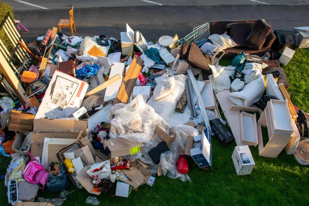 Large household junk pile including furniture and boxes removed by Dump Pro LA in Los Angeles