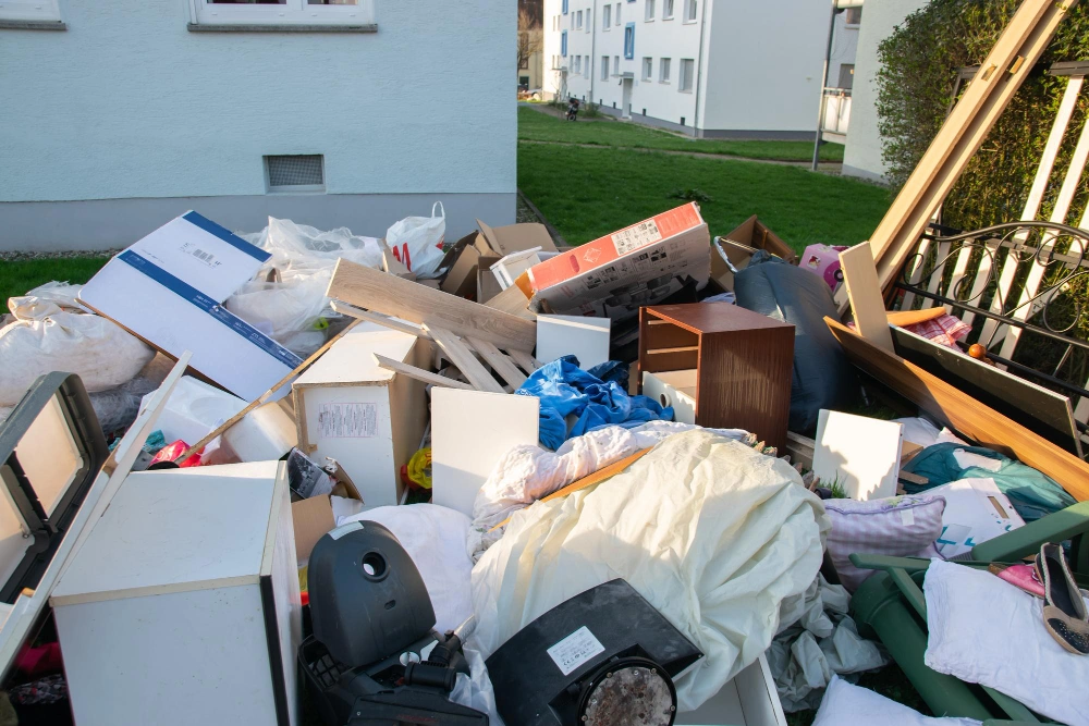 Large pile of mixed household junk prepared for dump removal by Dump Pro LA in Los Angeles